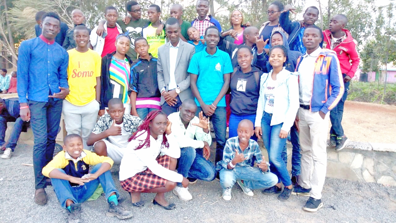 A group photo of Nursing students and their hosts during a community outreach in Sabakia and Mlolongo, Machakos County.