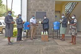 SONS, UoN Academic members of staff receiving hand washing equipment and hand sanitizers from PS Kenya.
